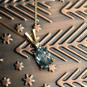 14k gold 1 carat aquamarine and diamond necklace.